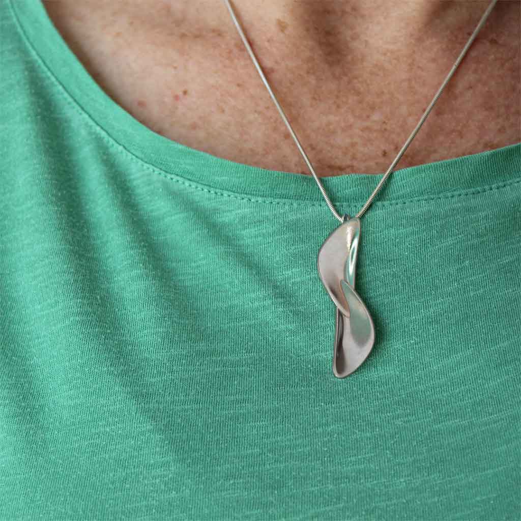 Pendant worn by a customer